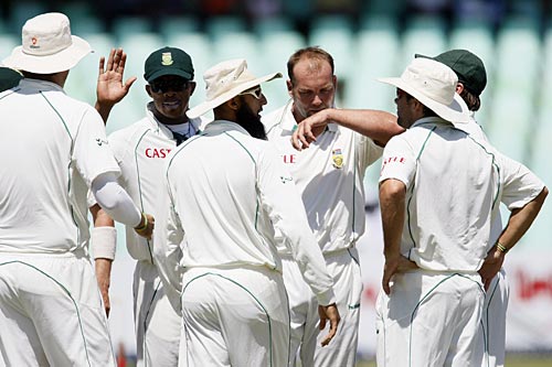 Team-mates congratulate Jacques Kallis on picking up Simon Katich's wicket