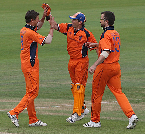 Pieter Seelaar is congratulated by team-mates after picking up a wicket