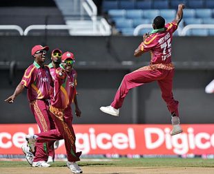 Jerome Taylor is airborne after getting rid of Dinesh Karthik, West Indies v India, 2nd ODI, Kingston, June 28, 2009 