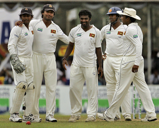 Team-mates crowd around Muttiah Muralitharan after he dismissed Iain O'Brien, Sri Lanka v New Zealand, 1st Test, Galle, 4th day, August 21, 2009