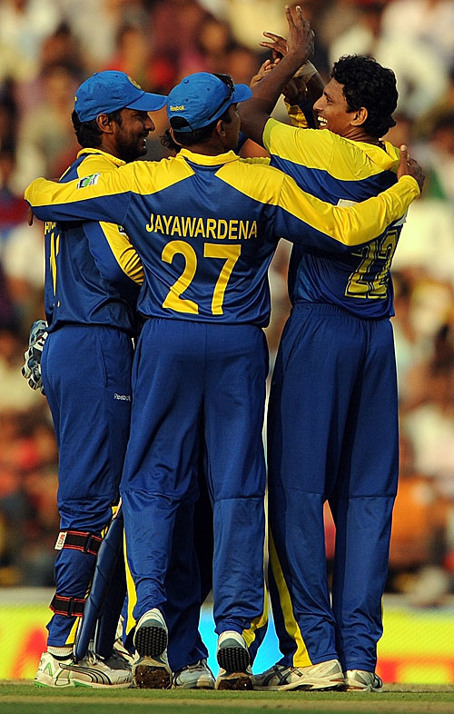 The Sri Lankan fielders celebrate Suraj Randiv's first ODI wicket