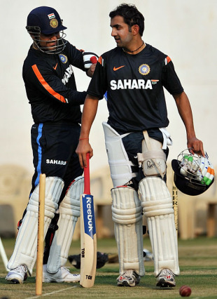Virender Sehwag helps Gautam Gambhir with his gear, Nagpur,  February 3, 2010