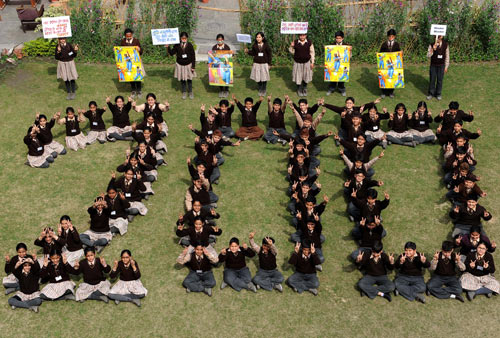Indian schoolkids form the number 200 
in tribute to Sachin Tendulkar's double century