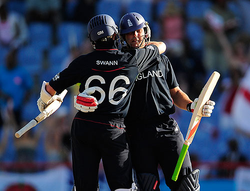 Tim Bresnan and Graeme Swann embrace as England complete a comfortable three-wicket victory