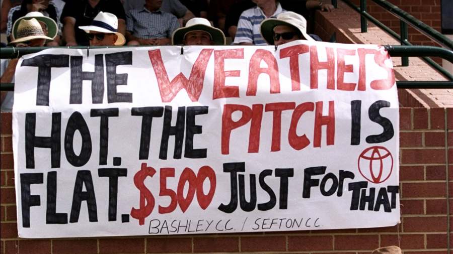 Spectators display a banner referring to the betting scandal involving Mark Waugh and Shane Warne