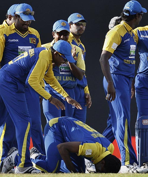 The Sri Lankans gather around hat-trick hero Farveez Maharoof