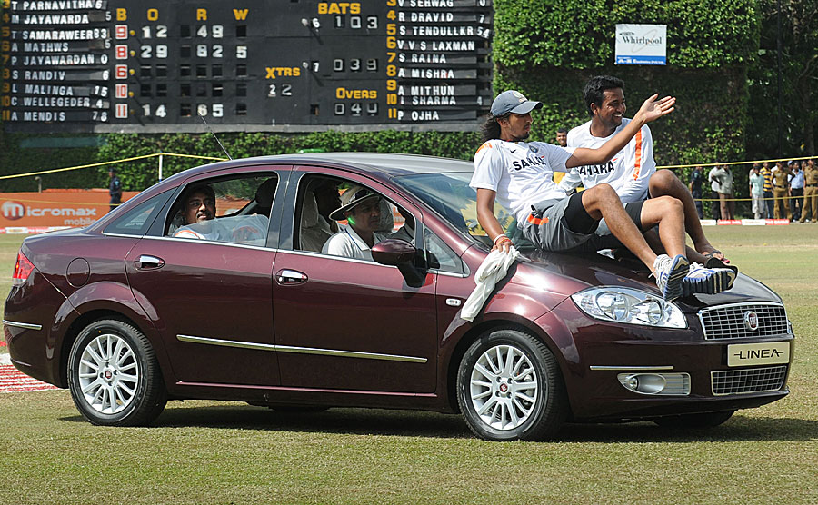 Virender Sehwag drives his Man-of-the-Series prize with his team-mates piling on wherever possible