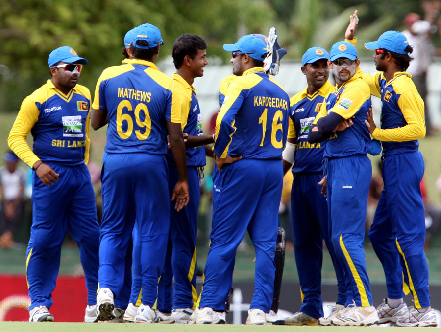 Sri Lanka celebrate the fall of an Indian wicket