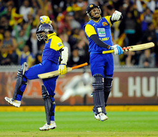 Angelo Mathews and Muttiah Muralitharan jump for joy after Sri Lanka's miraculous one-wicket win in the first ODI against Australia