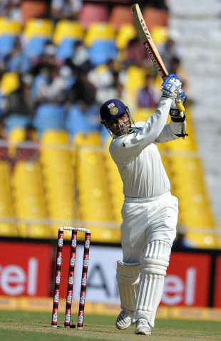 Virender Sehwag launches one straight, India v New Zealand, 1st Test, Ahmedabad, 1st day, November 4, 2010