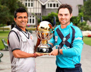 Khurram Khan and Preston Mommsen pose with the World Cup 2015 Qualifier trophy on the eve of the final between UAE and Scotland in Lincoln © IDI/Getty Images
