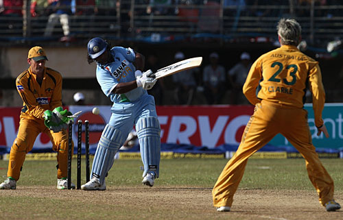 Ramesh Powar is bowled by Michael Clarke