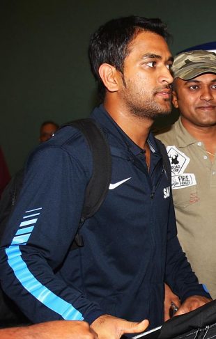 Mahendra Singh Dhoni makes his way out of the airport, Auckland, February 20, 2009
